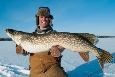 Image: Experience the Thrill of Ice Fishing in Northern Canada's Frozen Lakes